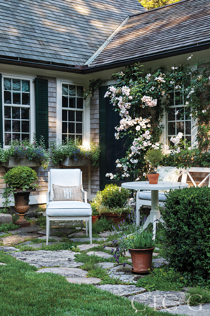 outdoor seating area at a shingle-style home