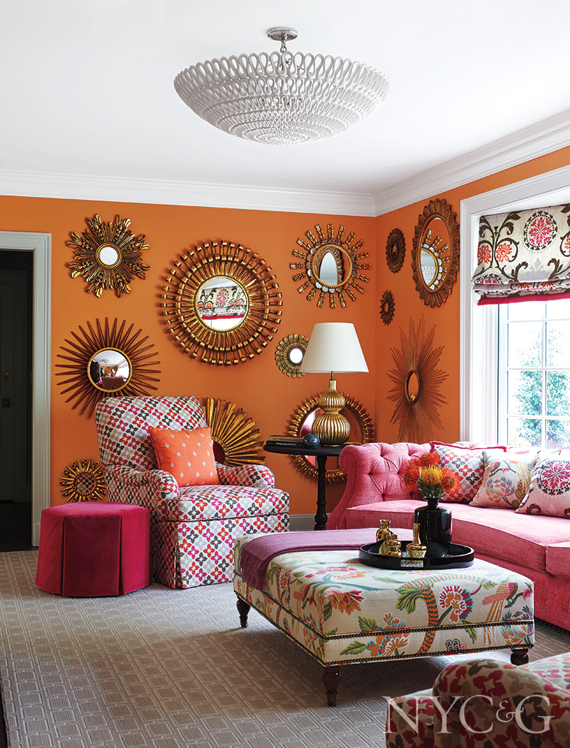 Sunburst Mirrors In Orange And Pink Living Room