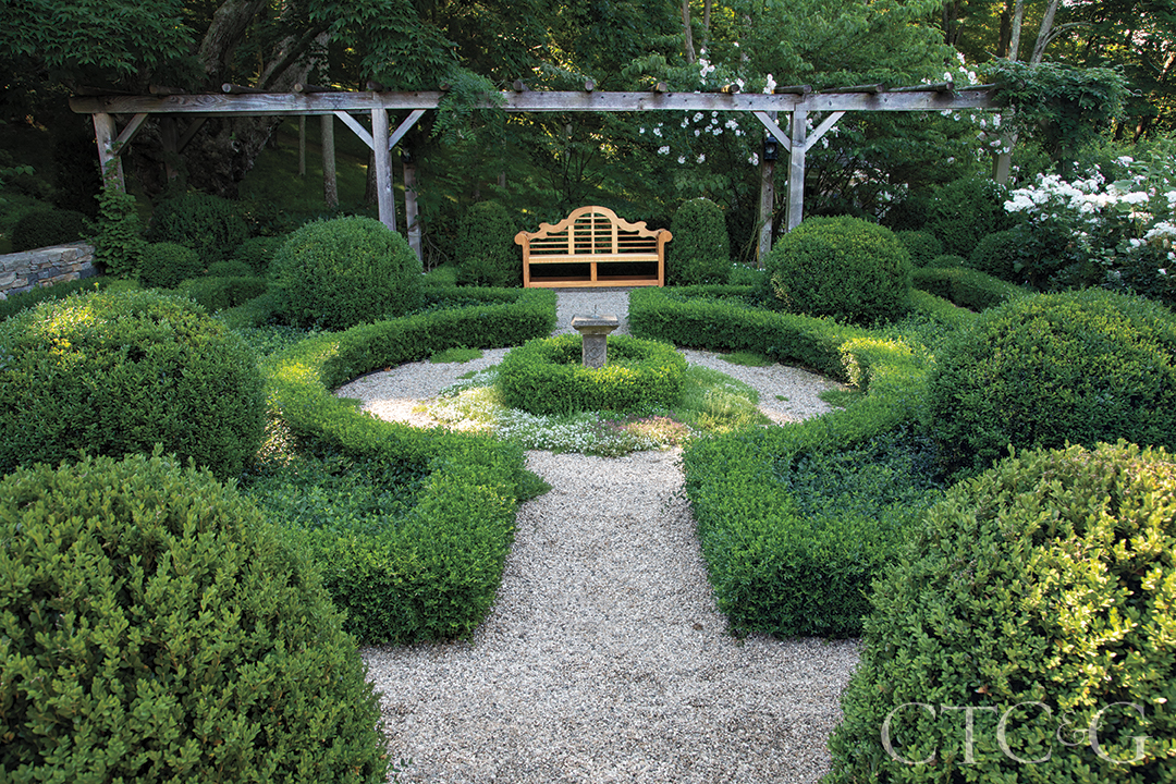 teak bench at huge backyard garden