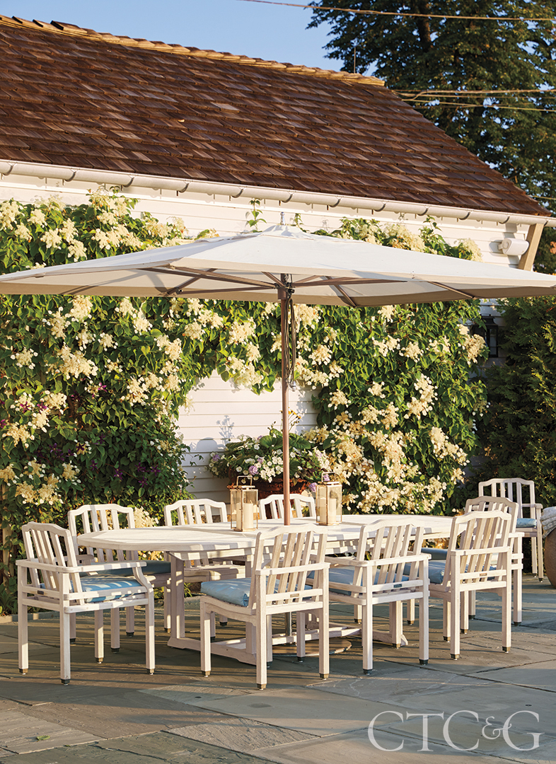 White Outdoor Table And Chairs With Huge Umbrella