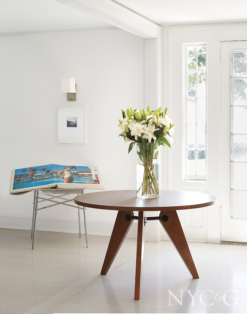 vintage table and floral arrangement in entryway