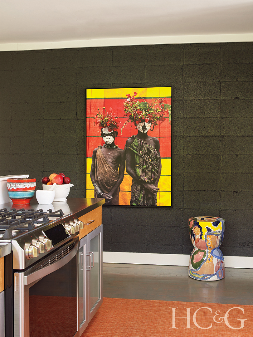 Black Brick Wall and Antique Artwork and Stainless Steel Stove