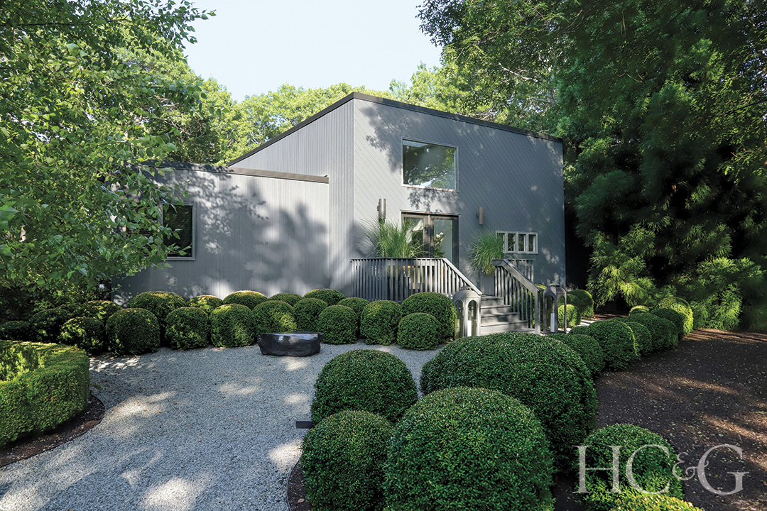 east hampton home painted cedar exterior; boxwood plants
