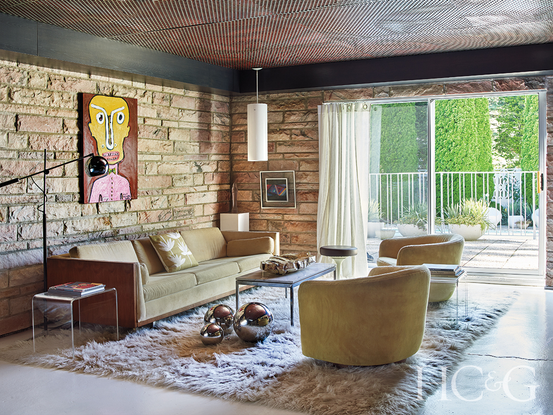 Neutral Living Area Design and Stone Wall and Sofa and Round Chairs