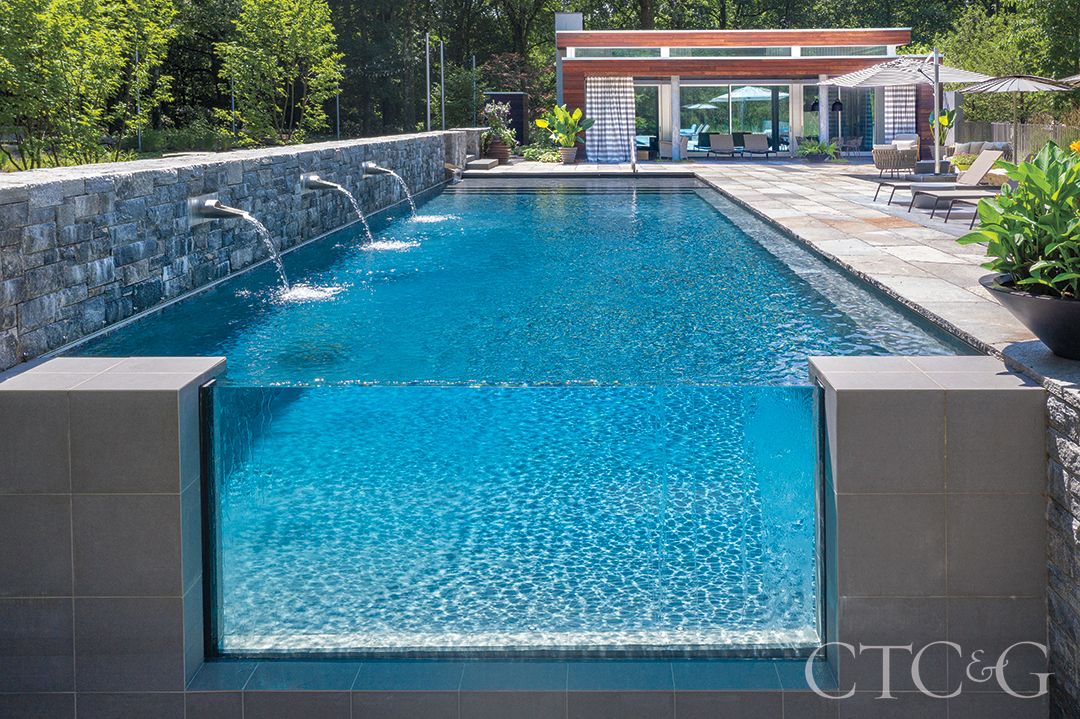 infinity pool with lounge chairs and cabana