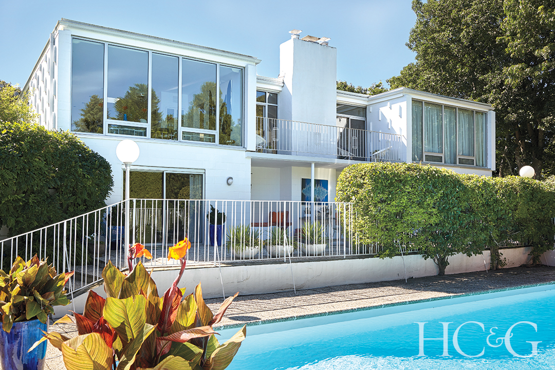 Backyard Pool with Fenced Porch and Floor-to-Ceiling Windows