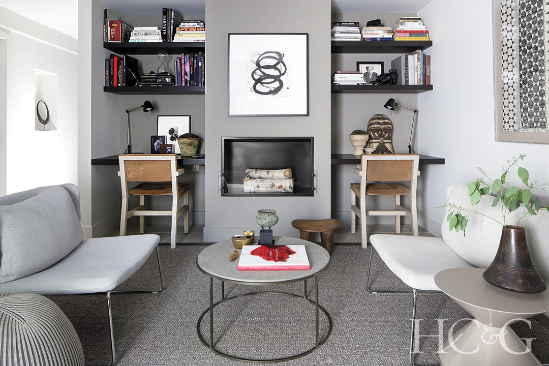 minimalist artwork and vintage cocktail table in study