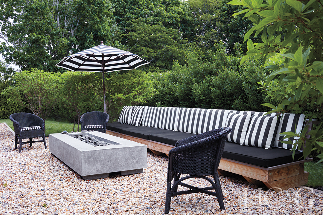 black and white courtyard patio furniture and fire table