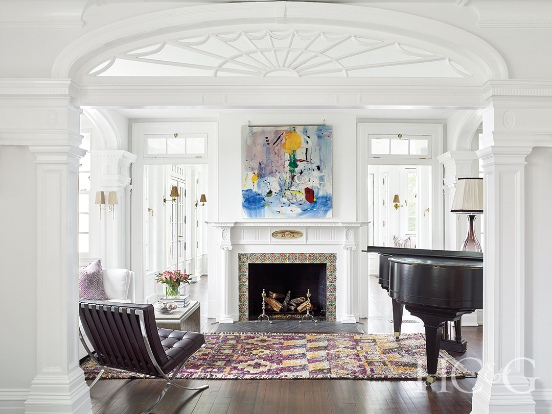 piano room decorative canvas hangs above fireplace