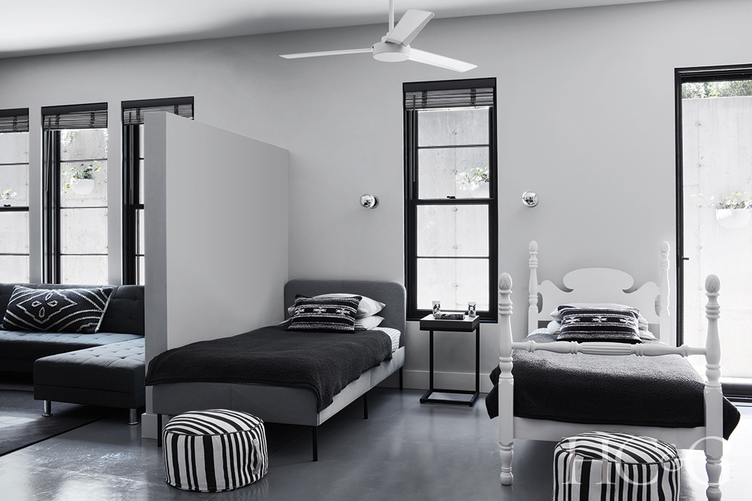 black and white bunk room; striped ottomans