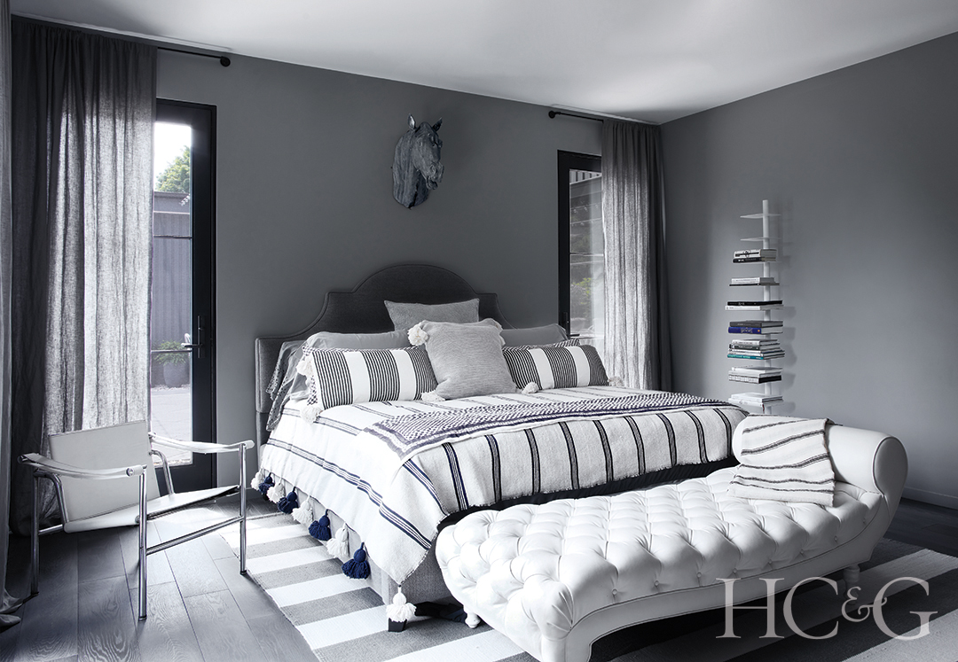 high-end chaise and headboard in guest bedroom