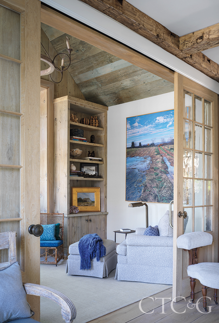 wall paintings and wood ceilings in den