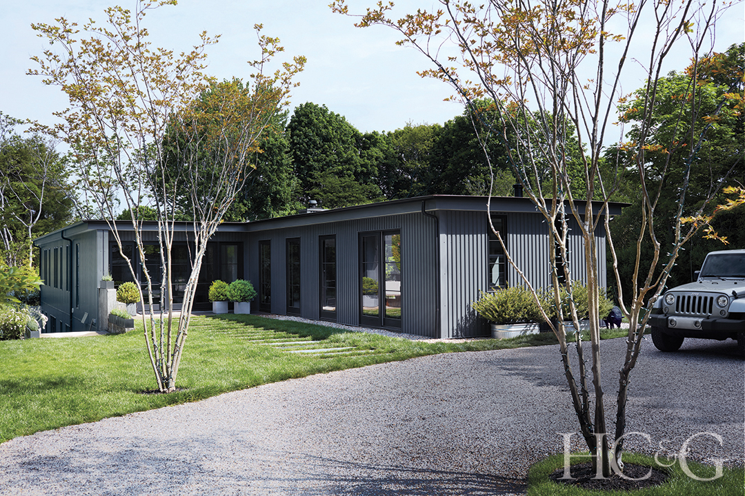 metal siding on exterior; minimalist landscaping