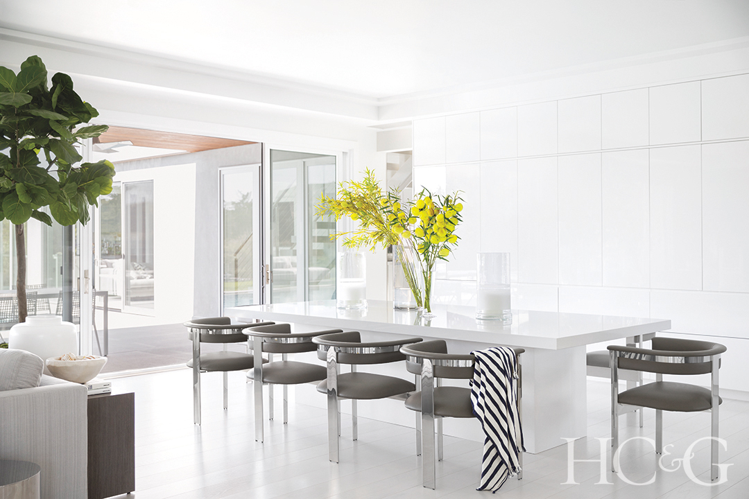 dining chairs and table in dining room; floral centerpiece