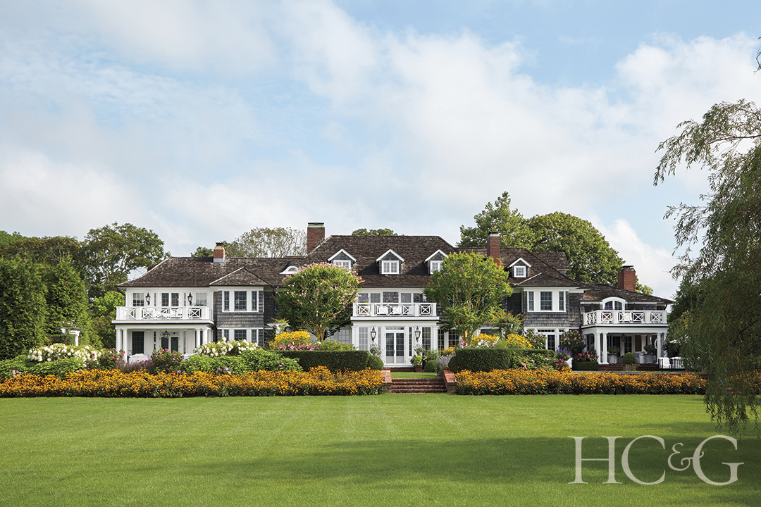 grand exterior manicured lawn and landscaping