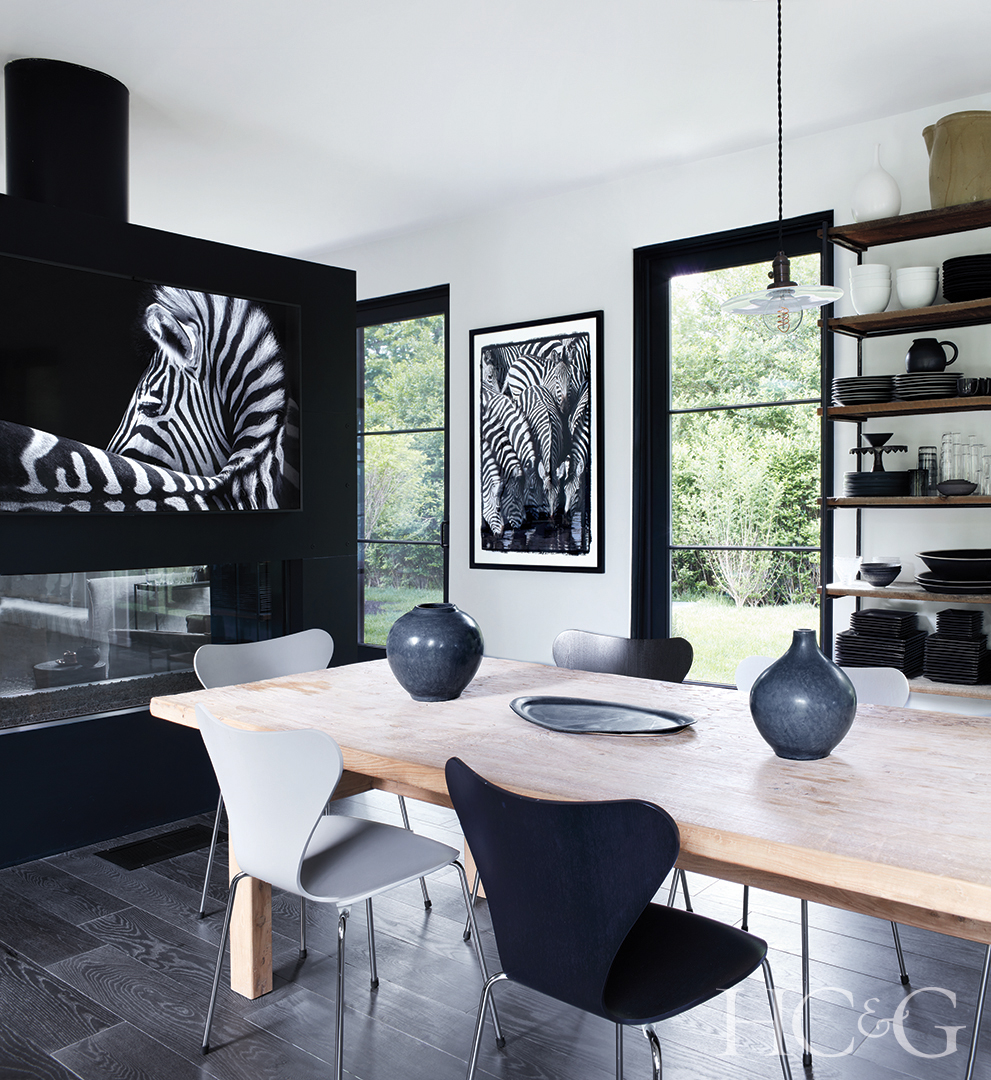 dining table and striking photography framed on walls