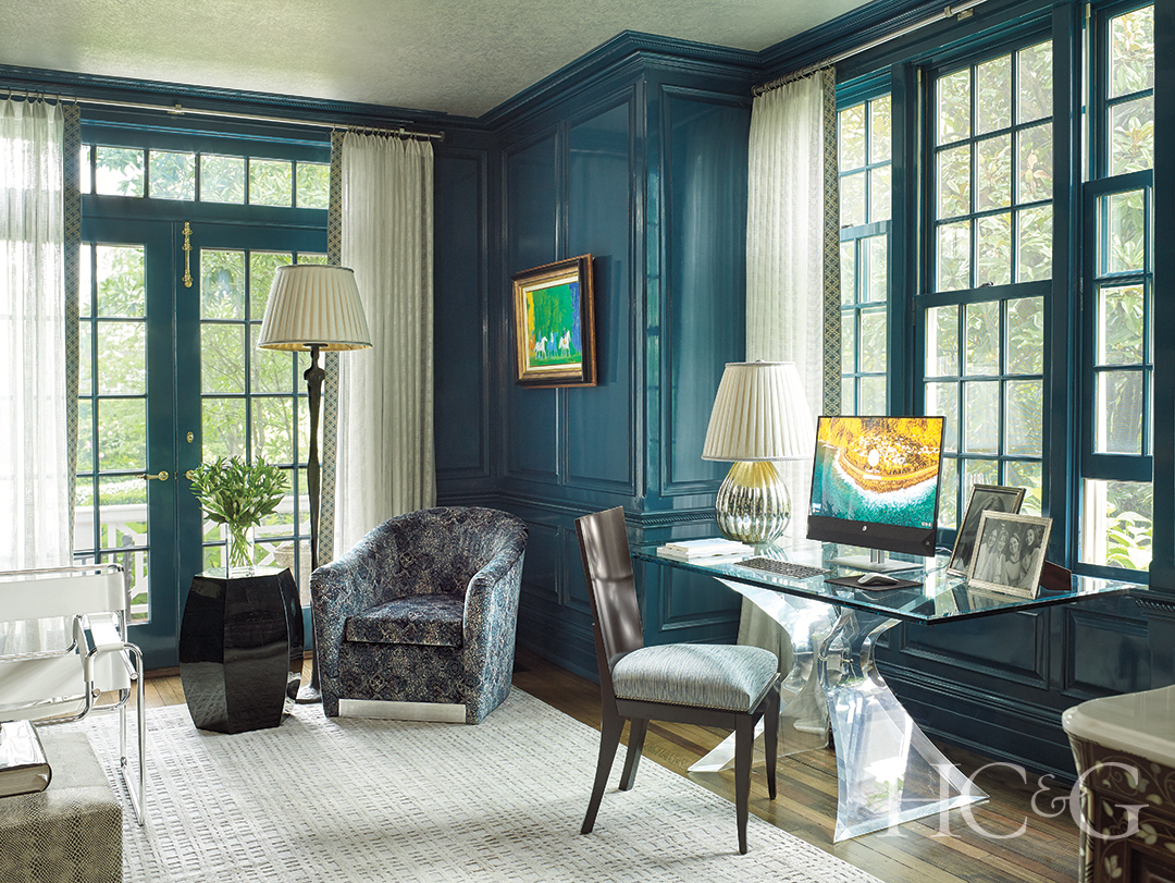 home library glass desk and gray area rug