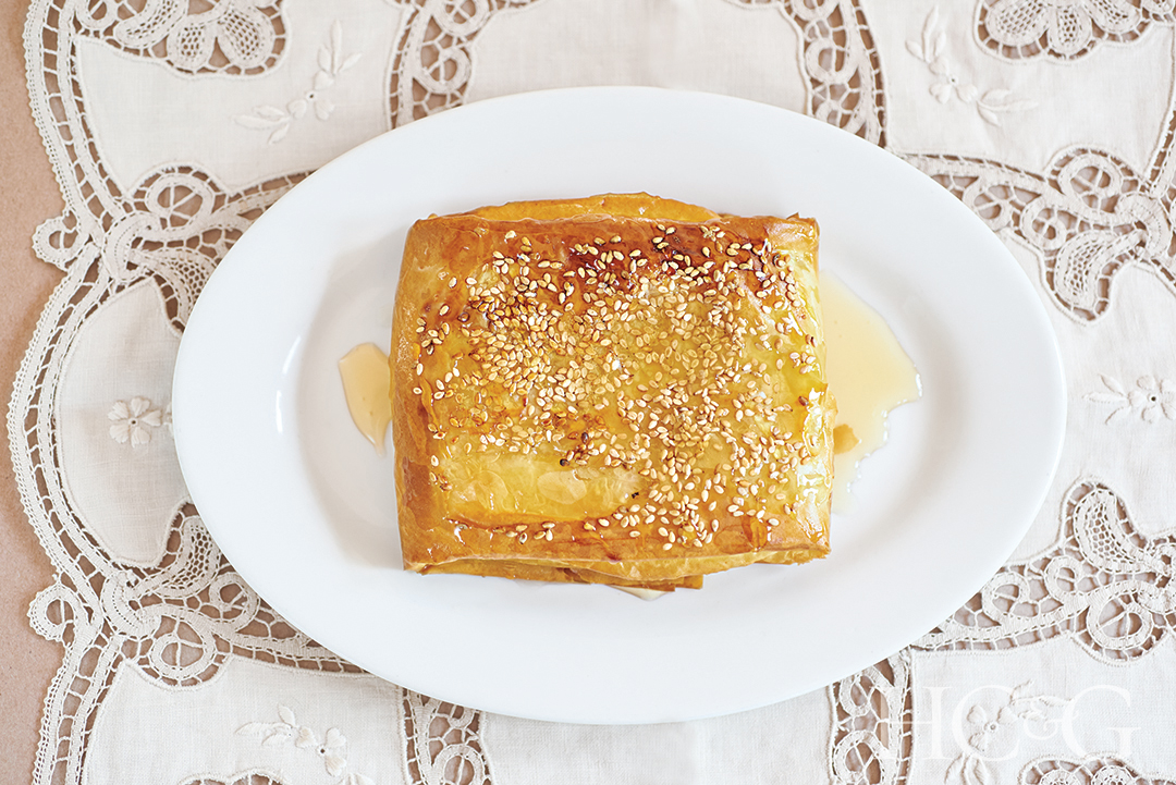 Greek dessert of feta baked in phyllo and topped with Cretan honey and sesame seeds
