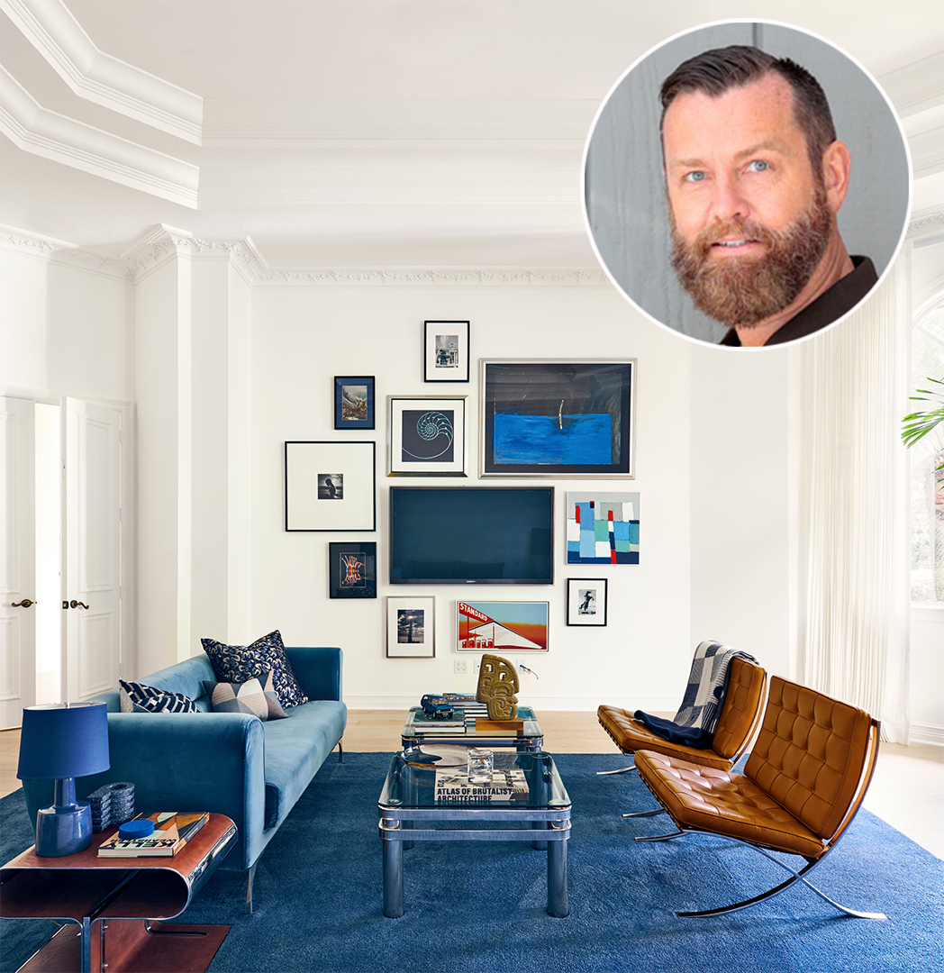 art collage wall; blue rug, velvet couch, leather chairs, coffee tables