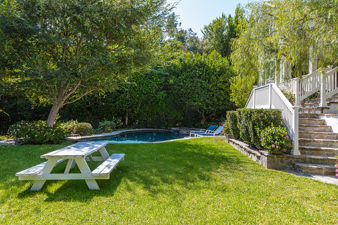 Mila Kunis And Ashton Kutcher Seek To Sell Their Traditional Beverly Hills Home Pool