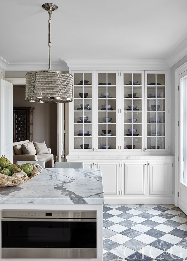 checkered floors; marble countertop; white kitchen cabinets