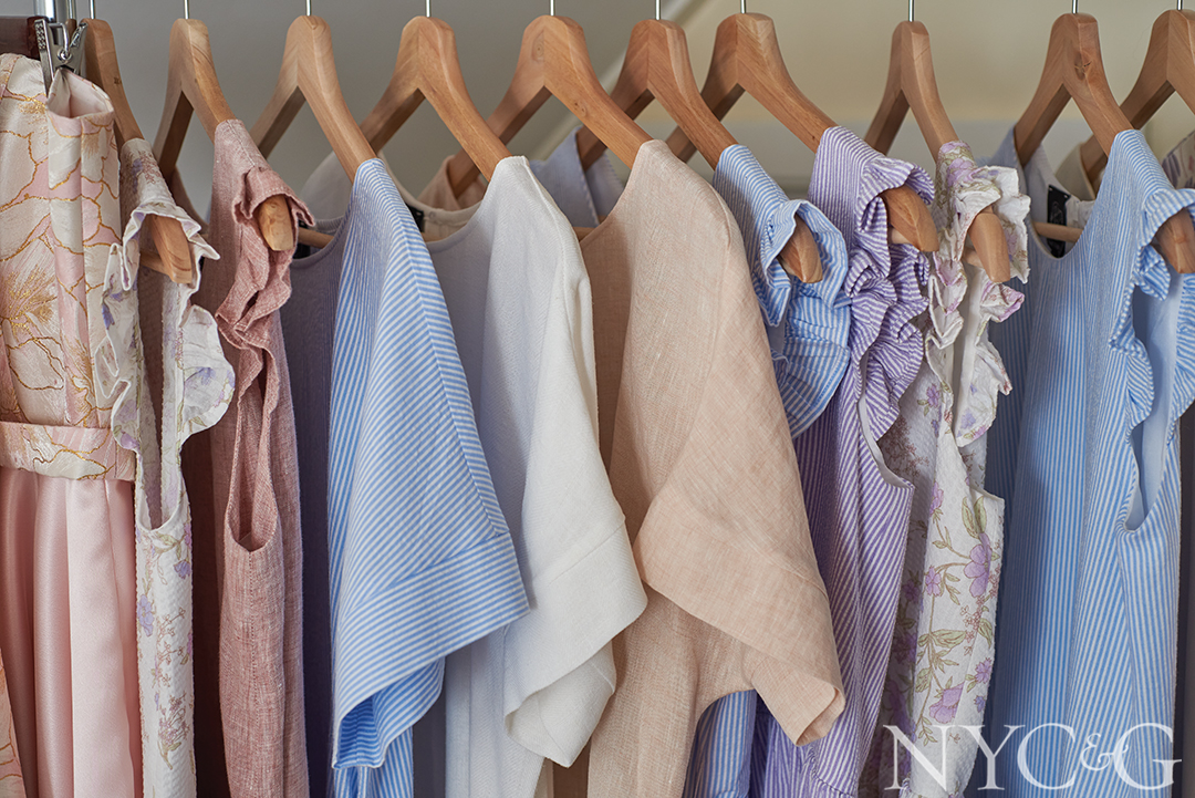 clothes hanging on wooden hangers