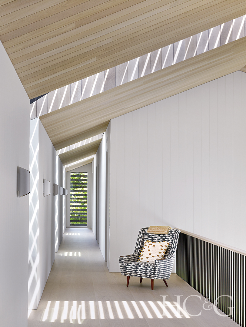 minimalistic modern hallway; white slats, wooden celling slats