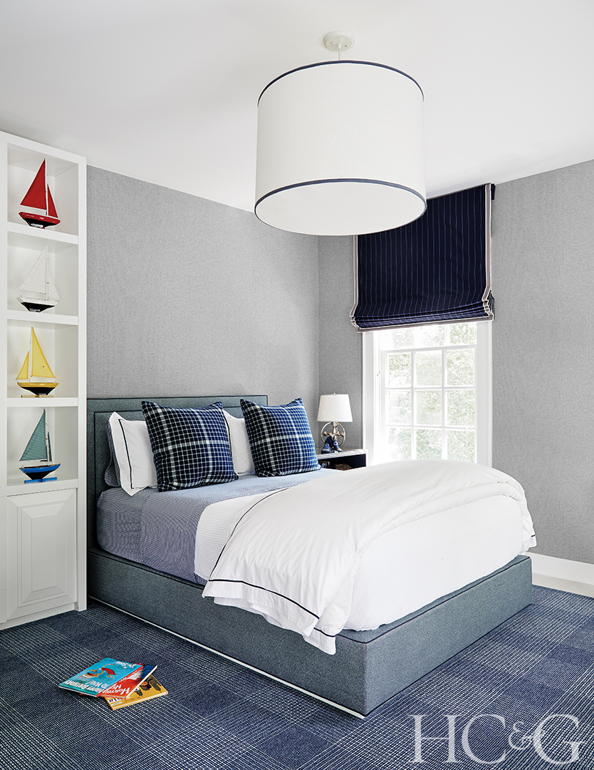 Blue and white bedroom; plaid pillows