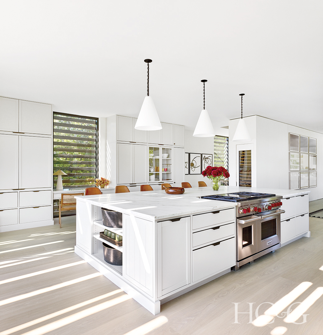 huge all-white kitchen island; white kitchen cabinets