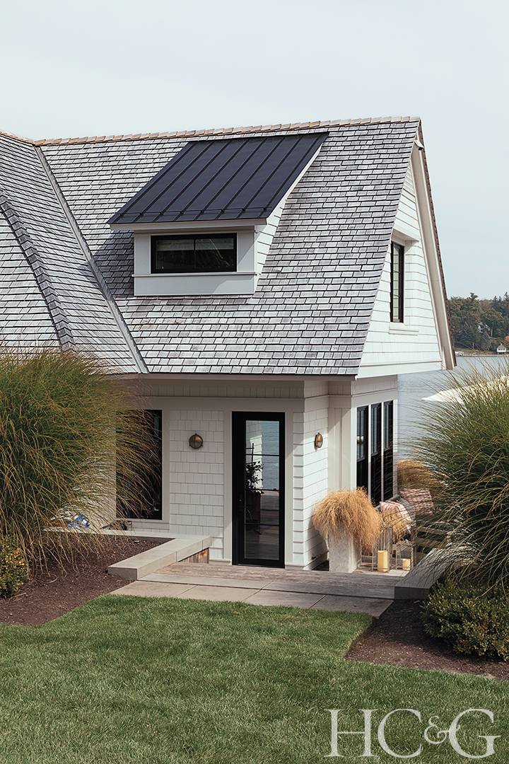 white shingle boathouse