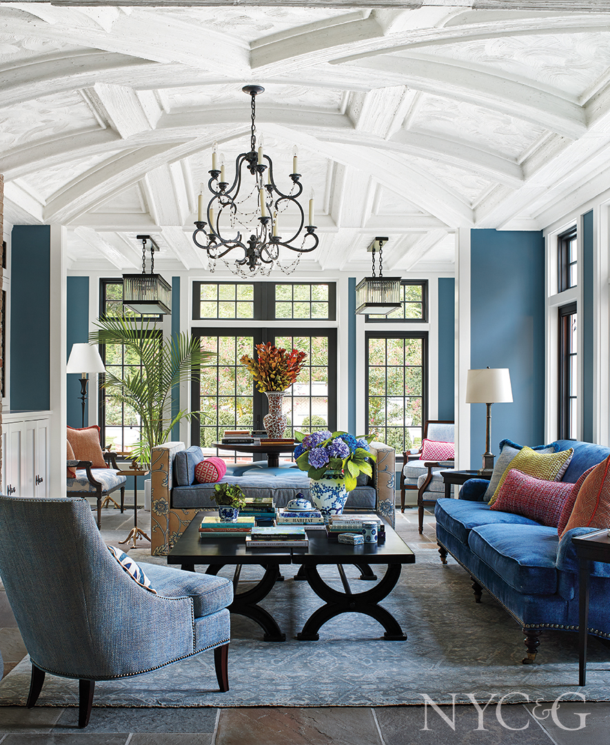 Huge Blue Great Room With Multi Colored Pillows And Accents
