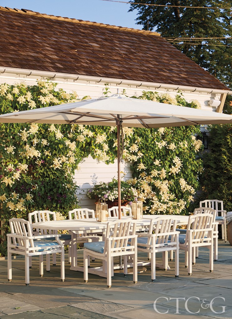 White Outdoor Table And Chairs With Huge Umbrella 745x1024