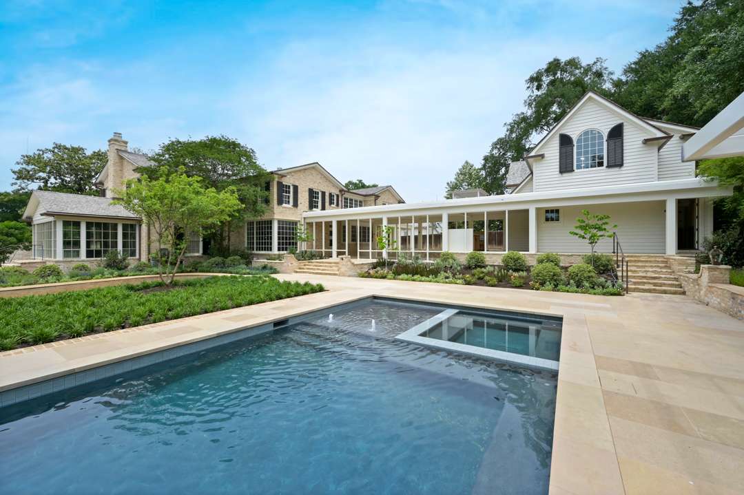 In-ground pool with patio surrounding