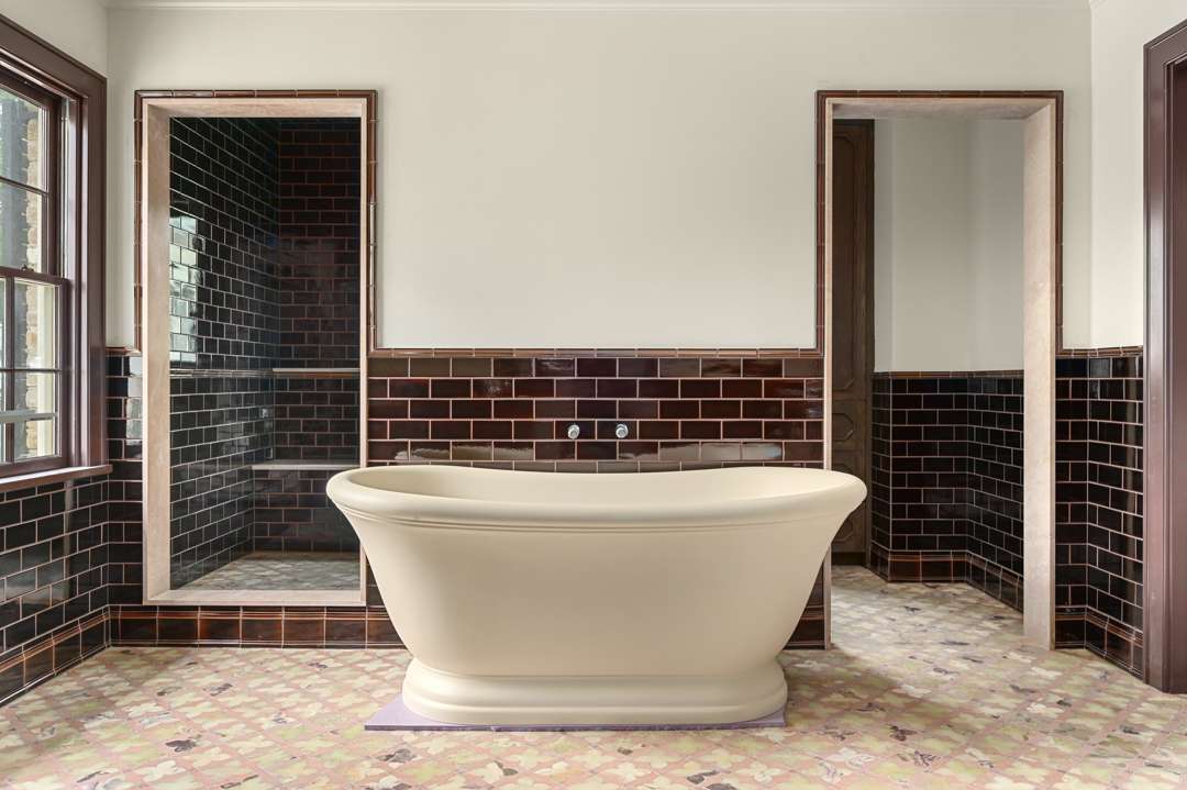 Tiled bathroom with bathtub