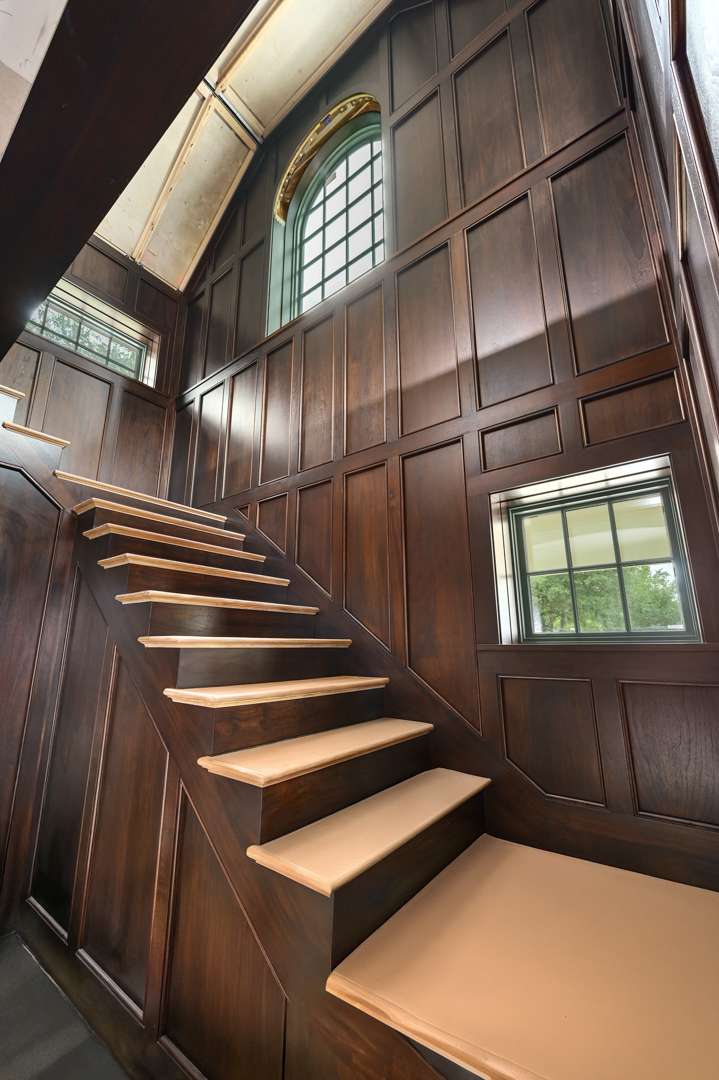 Staircase with high ceilings and classy windows