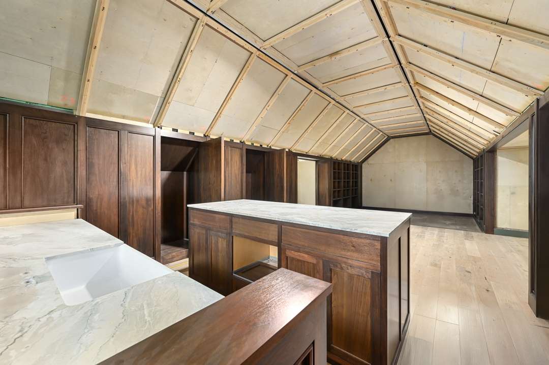 Large room with wooden cabintery