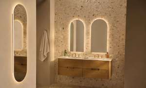 Luxurious bathroom with backlit mirrors