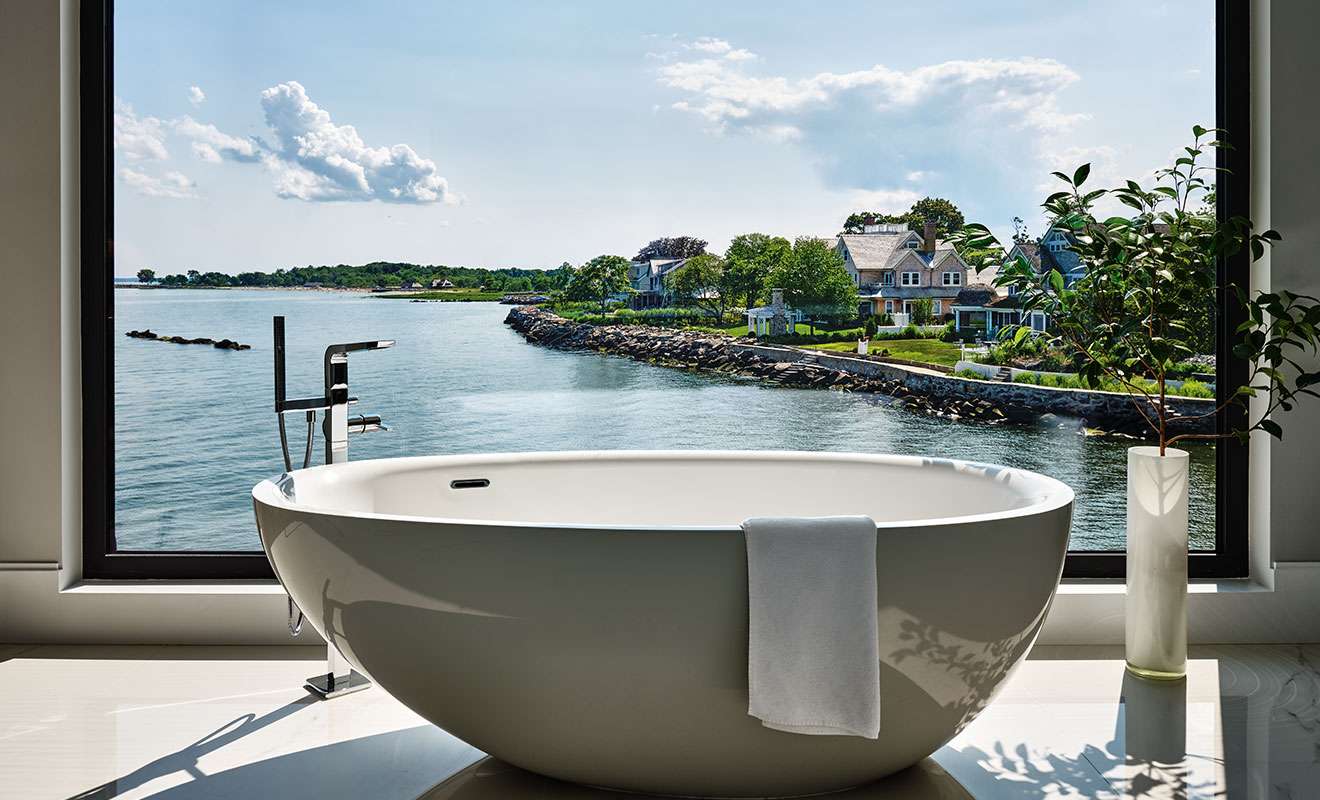 White bathtub with serene view
