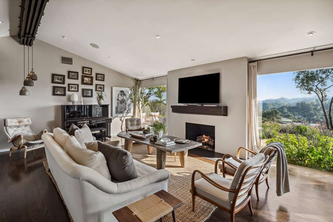 Unique light fixtures hang in living room corner