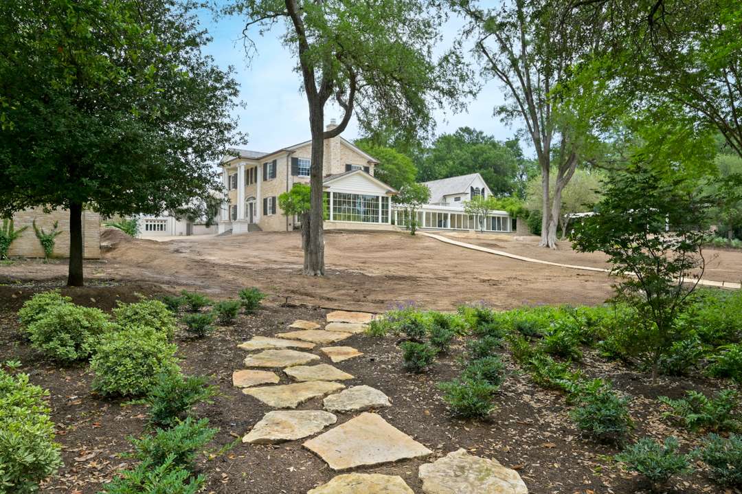 Open backyard with various stone pathways