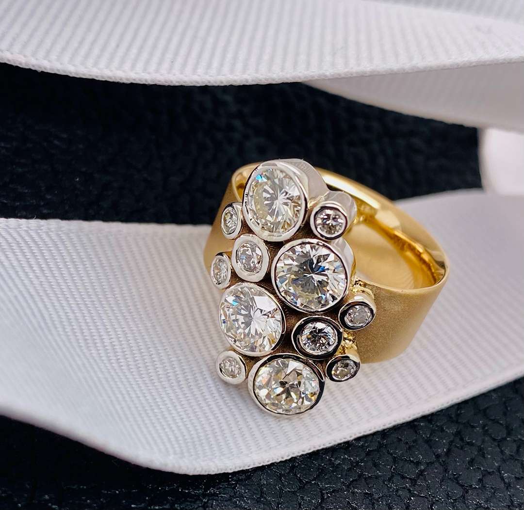 Vertical collage of jewels on golden band