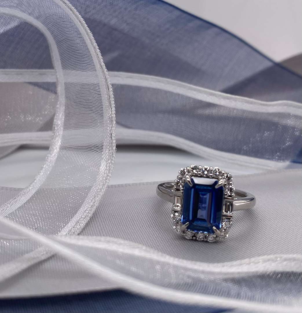 Silver ring with blue diamond