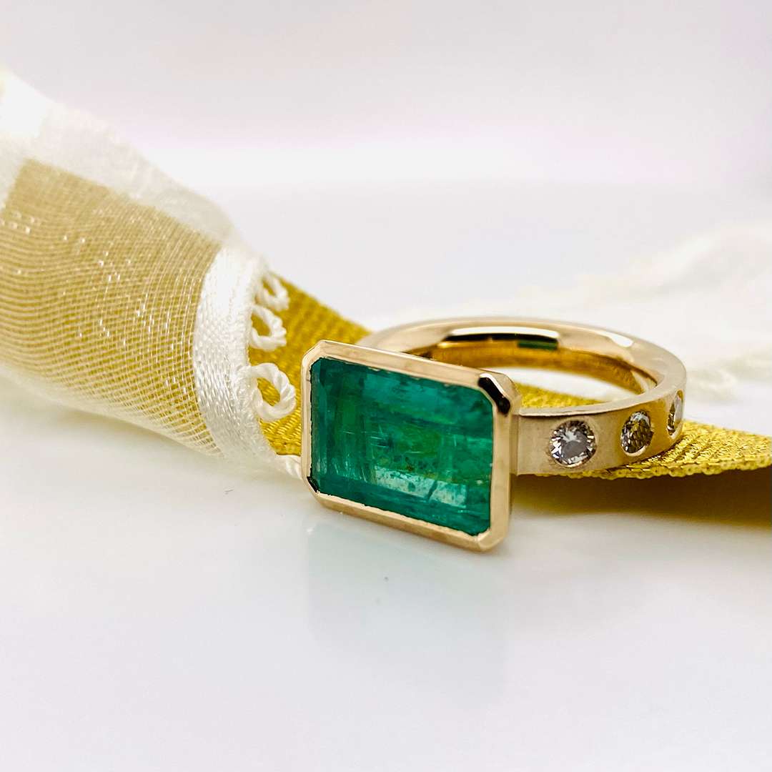 Gold ring with green stone