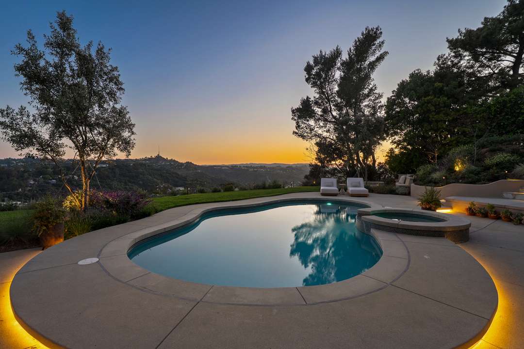 Warm lights surround Hollywood Hills pool