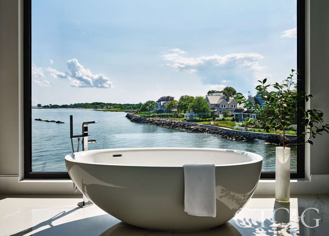 White bathtub with serene view