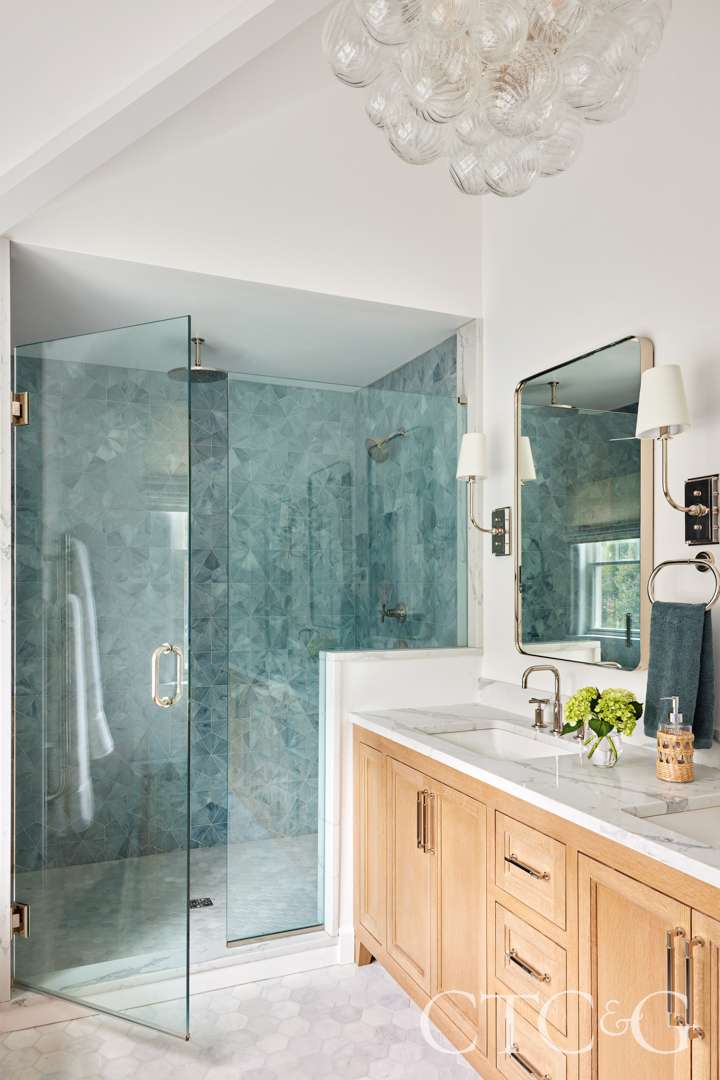 Elegant primary bathroom shower with glass door