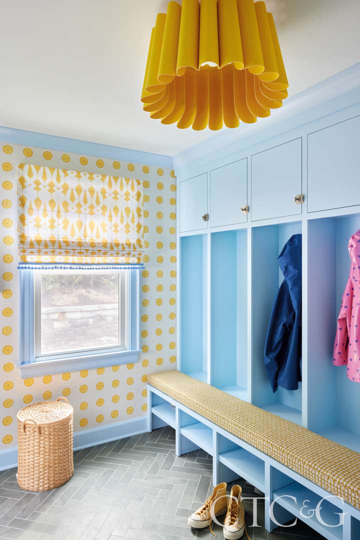 Energetic mudroom with blue built-ins