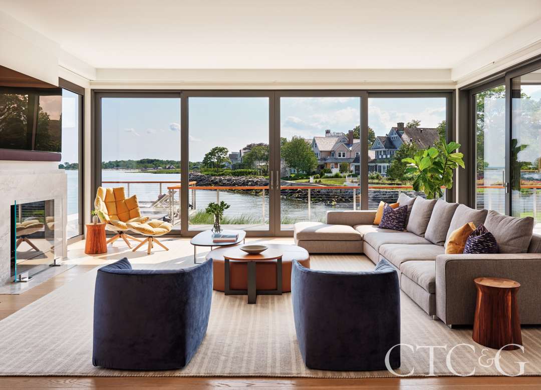 Window surrounding family room with Italian sourced furniture