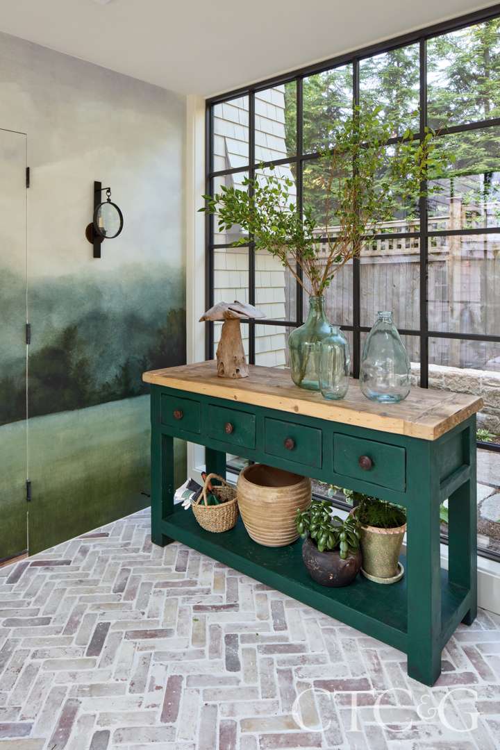 Natural mural covers the passageway that links the garage to the main house