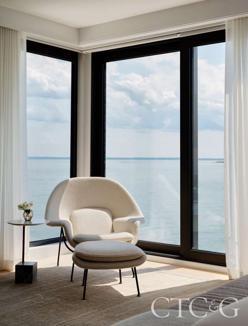 An Eero Saarinen Womb chair positioned to take in natural light